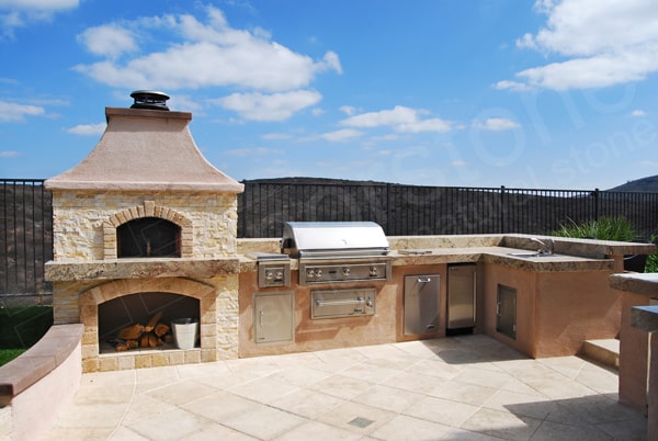 Stacked Stone Veneer used on an outdoor kitchen with pizza kitchen and low profile stone backsplash